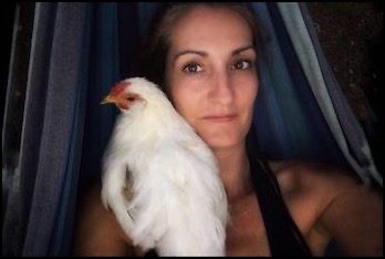 Nicole Elizabeth holding white chicken